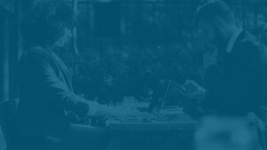 Individual Service Landing page photo of two people sitting at a table.