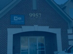 MKR - Front of building with new sign.
